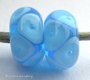 Aqua Sky Blue Bubbles transparent aqua with sky blue offset bubbles 7x12 mm 2.5mm hole price is per bead All of my lampwork glass beads are individually handmade using Effetre, Vetrofond, or Lauscha, Reichenbach, Double Helix, and Bullseye glass rods. They are annealed in a digitally controlled kiln for everlasting strength and durability.   Default Title