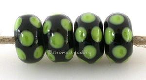 Black Pea Green Dice Dots A black base with pea green dice dots. 5x11 mm price is per bead Glossy,Matte