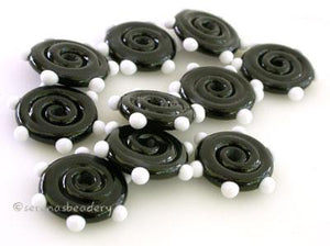 Black Wavy Spiral Disk with White dots Wavy disks that start with a black base and are dotted in white. Each disk is approximately 3x14 mm. The price is for a set of 10 disks. Try them in reverse: 11-12 mm 1.5 mm hole,12-13 mm 2.5 mm hole