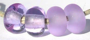 Dark Lavender Color Notes: good strong color - in fluroescent lighting look more blue 5x10 mm Available shapes and sizes:Round Bead Shapes: Available to order 8 to 15 mm with hole sizes ranging from 1.5 to 5 mm. See drop down menu for the exact options. Shown here in 8, 9 and 10 mm with both a 2.5 mm and 1.5 mm hole. 4 and 5 mm holes will fit European Charm style jewelry.Also available in a wavy disk or bead cap:. Pressed bead shapes:Lentil - 12x13 mm in size with a 1.5mm hole.: Pillow 13 mm square with a 1